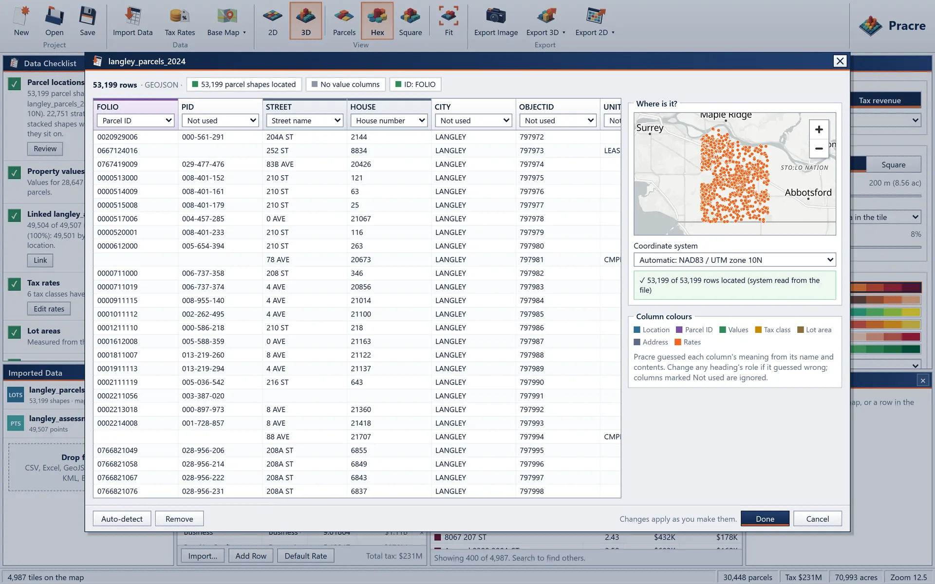 The import window for a parcel file, with column roles detected, the coordinate system read from the file and a preview map